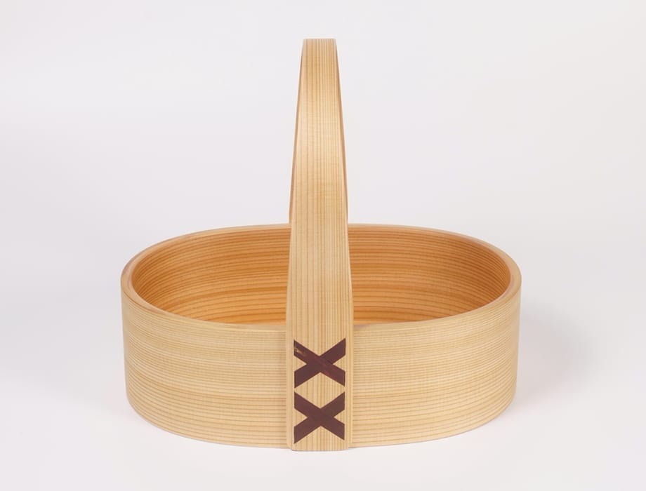 Oval wood basket with tall handle