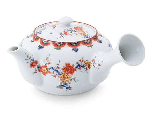 Teapot with plum and chrysanthemum design in overglaze