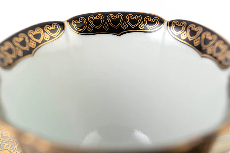 Teacup and plate with peach-patterned gold brocade (black)